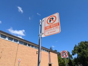 Close up of no parking sign due to fire route.