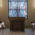 Podium in front of stained glass window