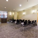 Chapel room set up with rows of chairs.