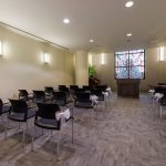 Chapel room set up with rows of chairs.