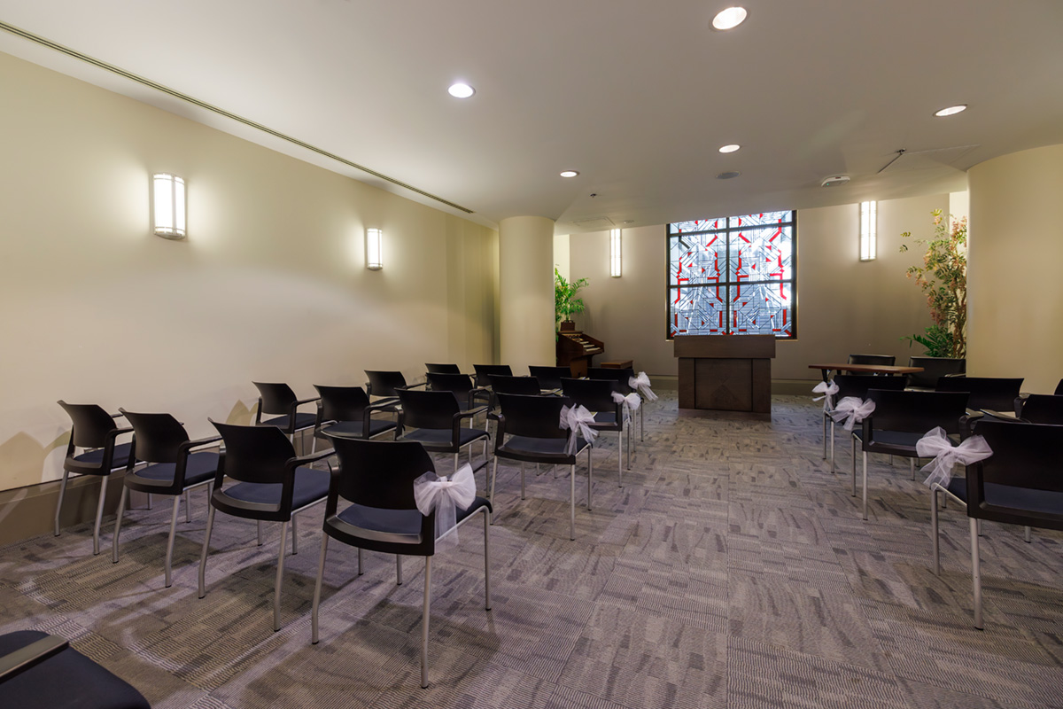Chapel room set up with rows of chairs.