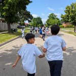 Photo: School children walking on the road.