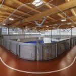 Upper-level indoor walking track overlooking the gym