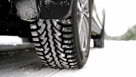 Car on winter tires on a snowy road