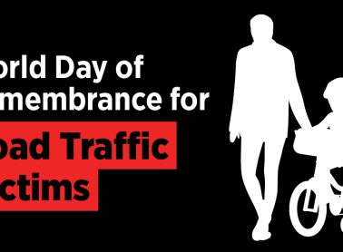 An adult accompanied by a child on a bike with text that reads World Day of Remembrance for Road Traffic Victims