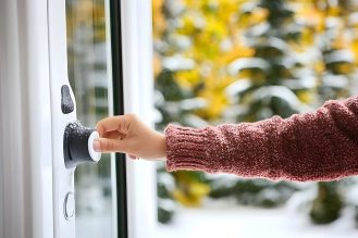 Hand ringing doorbell