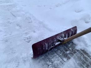 Shovelling snow on driveway