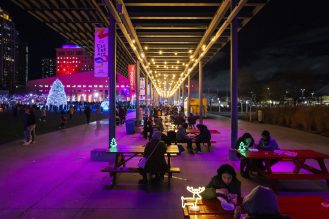 Group of people at Celebration Square enjoying food.