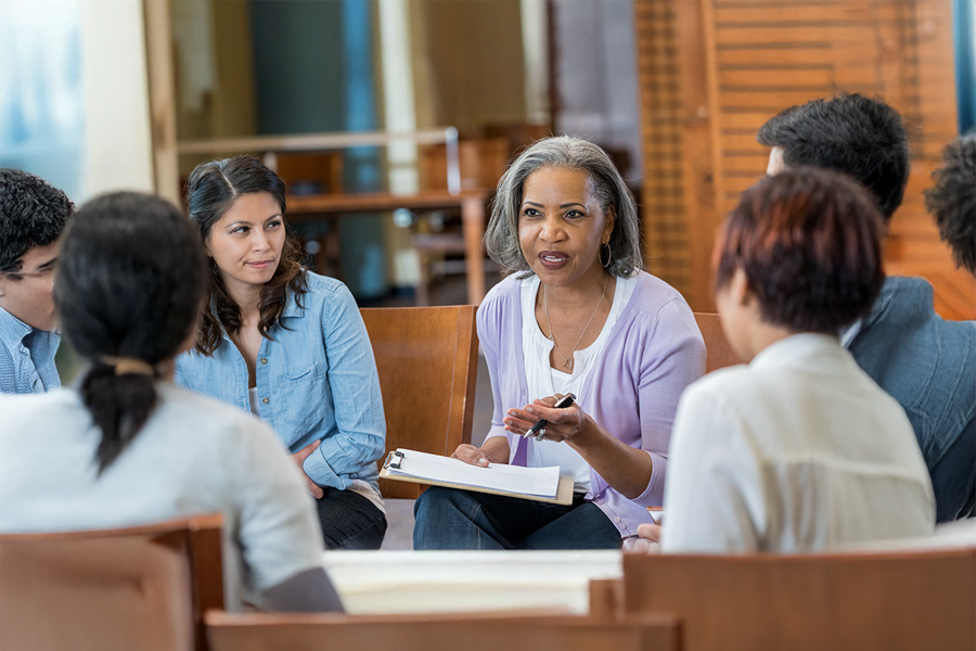 A group of people in an office meeting