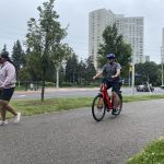 Cyclist and pedestrians on a multi-use trail