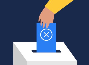 A hand placing a ballot in a bos