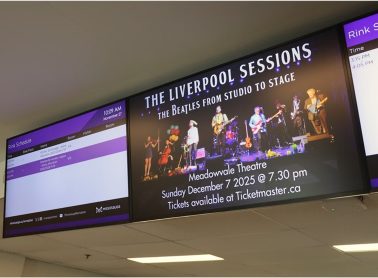 Digital screen promoting a live music event.