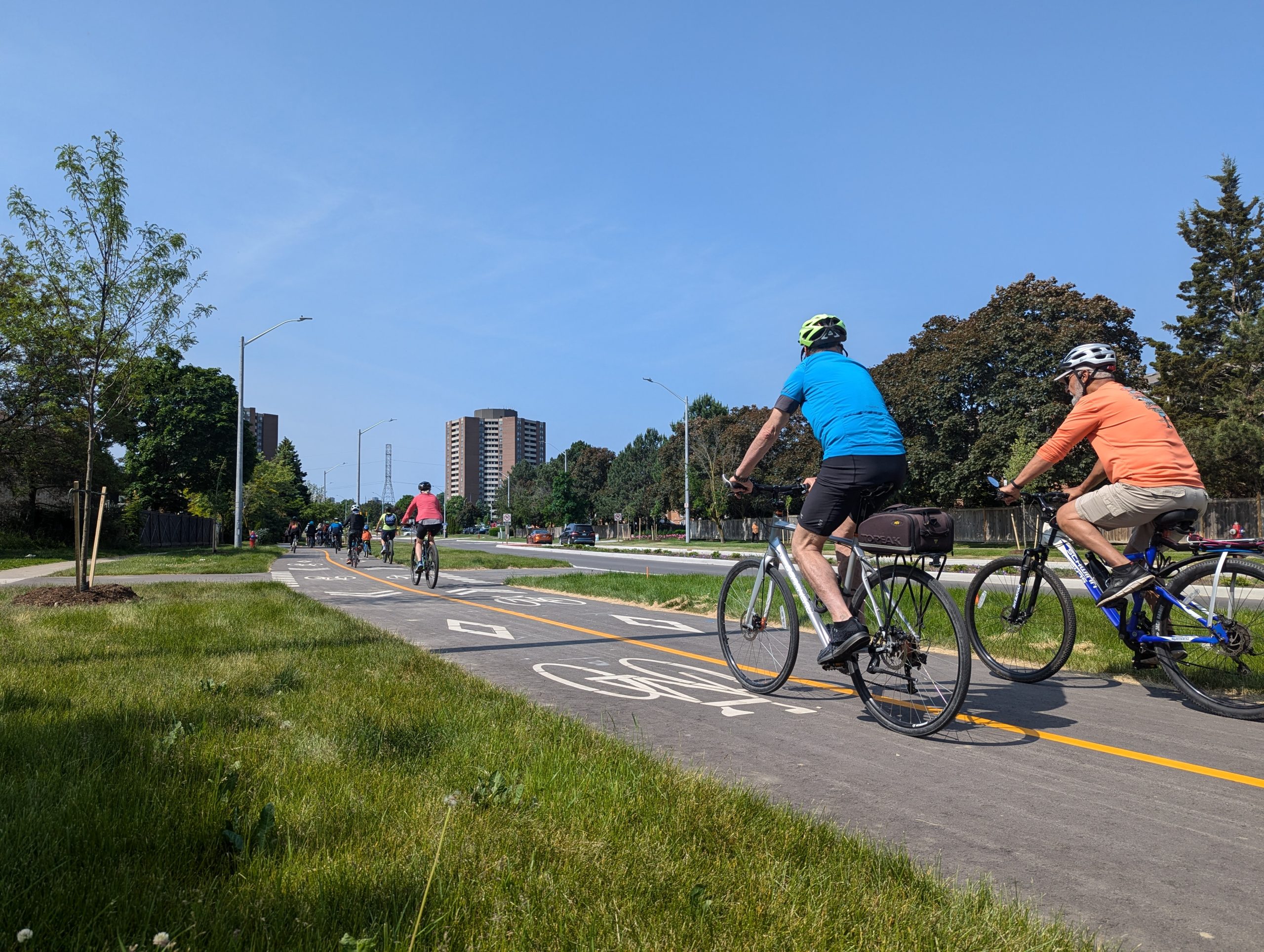 Bicycle riders riding on a bike path.