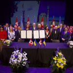 Mississauga and Ternopil representatives at the signing ceremony with the two mayors holding the declaration