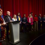 Mayor Serhiy Nadal of Ternopil speaking at the podium with an interpreter