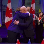 Mayor Carolyn Parrish and Mayor Serhiy Nadal embracing during the ceremony