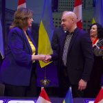 Mayor Carolyn Parrish and Mayor Serhiy Nadal shaking hands during the ceremony