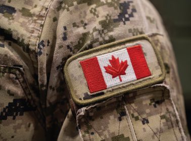A military member's uniform with a Canada Flag