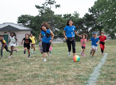 City of Mississauga staff lead a group of children in outdoor activities at a City park