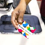 A colourful Mississauga Library card is scanned at a self-checkout station, highlighting access to library services, collections, and resources.