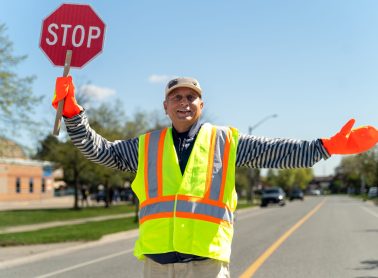 Crossing guard holding a stop sign