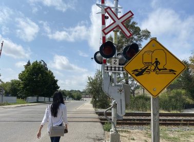Person crossing at a designated railway crossing