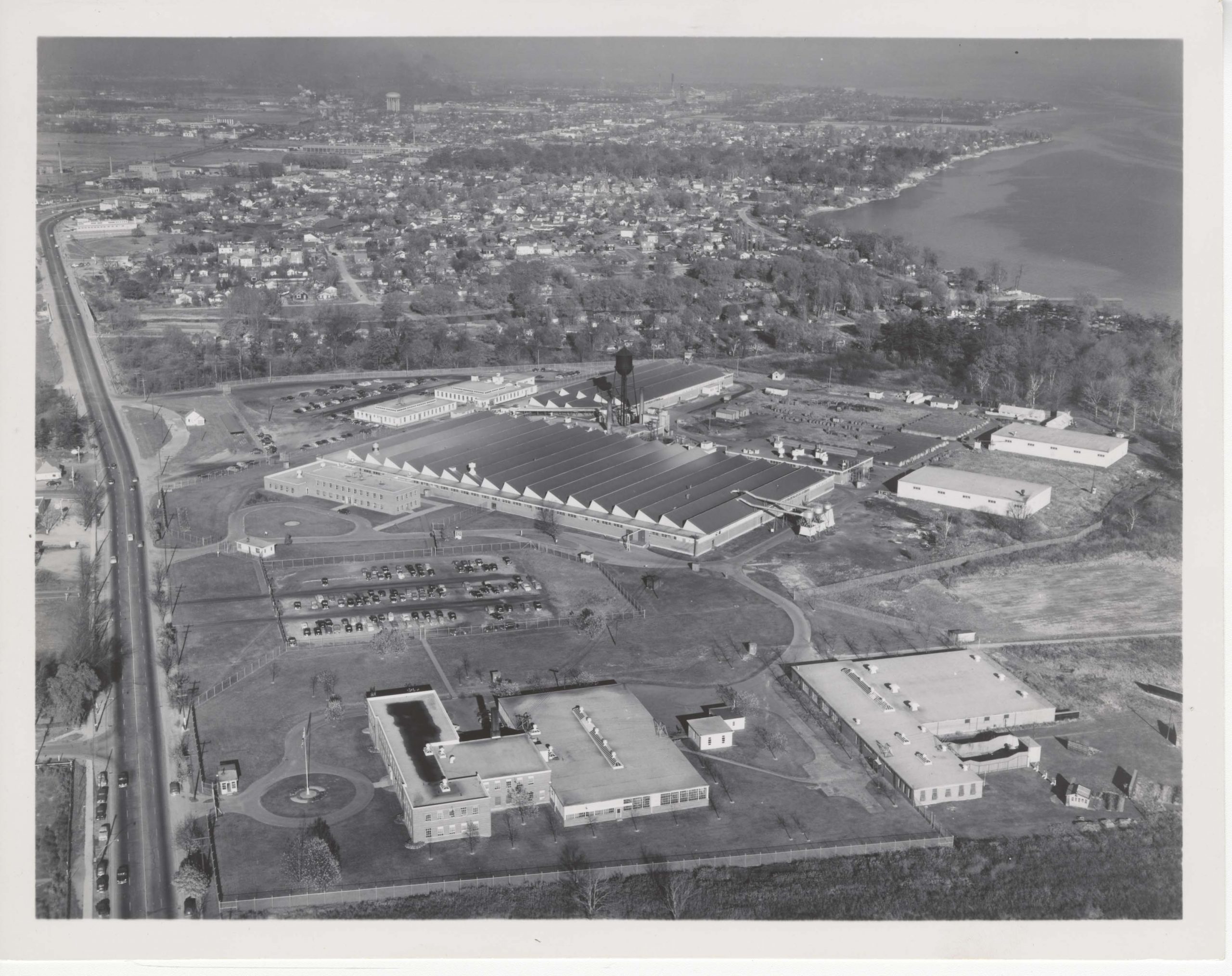 Black and white aerial photograph of the Small Arms Building in 1955