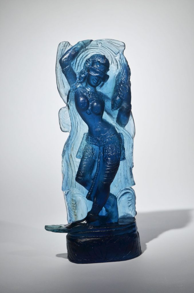 Blue glass sculpture of a goddess.