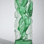 Green glass sculpture of a goddess.