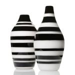 Two black and white-striped vases.