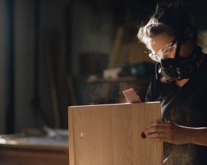 Artist working on wood project