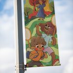 Banner with cartoon badminton duo
