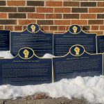 A row of historic plaques that honour Black Canadian history.