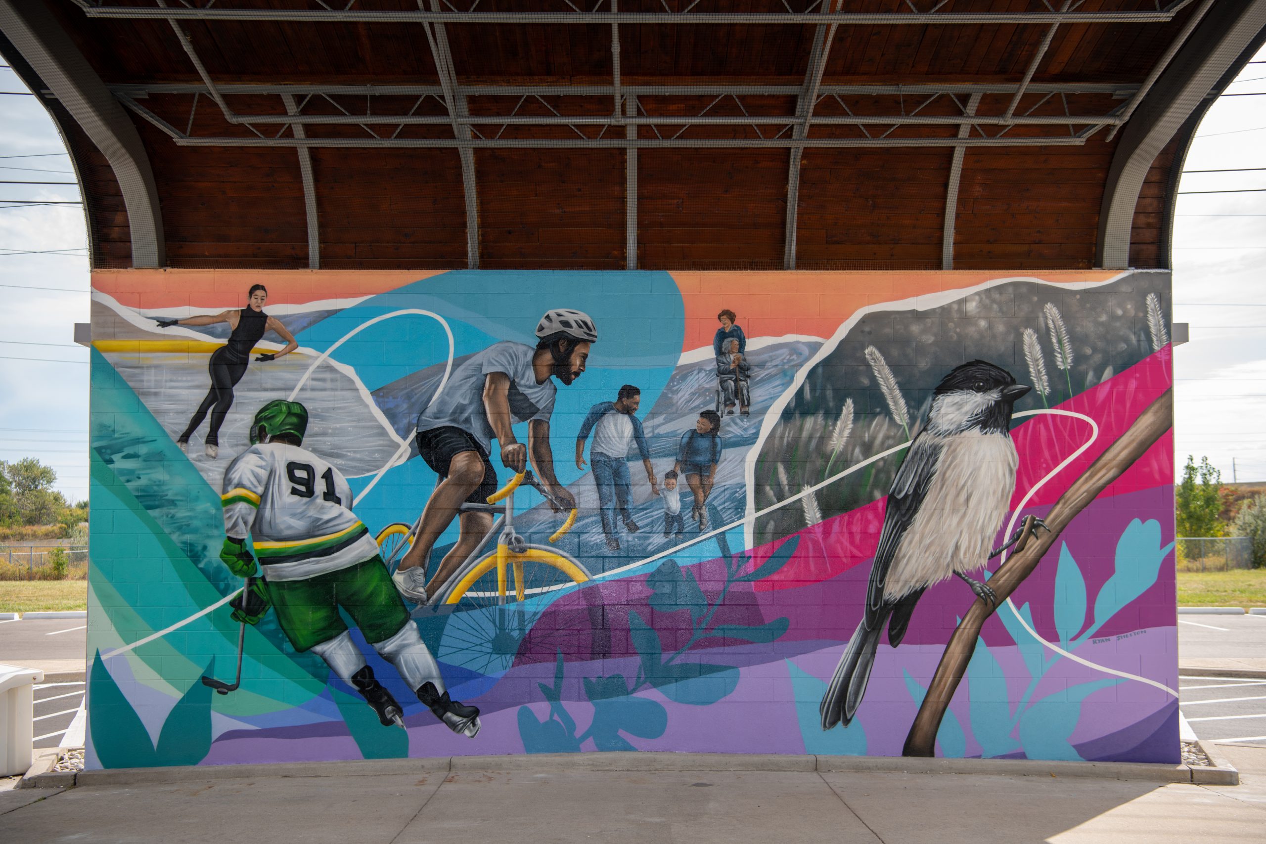 Mural with colourful depiction of athletes and nature