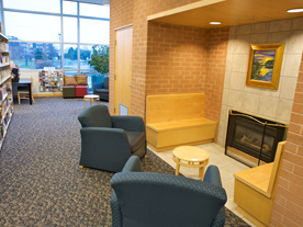 Chairs and a fireplace inside Clarkson Library