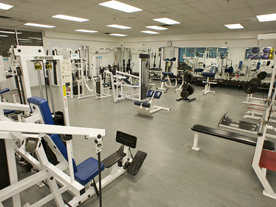 Interior of fitness centre showing rows of exercise equipment