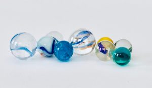 Close up of a row of glass marbles. in