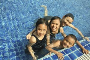 4 asian children swimming