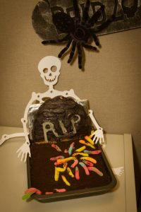 Chocolate cake with skeleton and gummy worms
