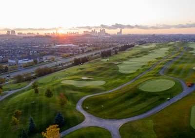 Aerial view of BraeBen holes 16 and 18 with City of Mississauga skyline in the distance.