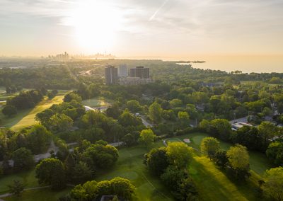 Aerial view of Lakeview Golf Course with City of Toronto skyline in the distance.
