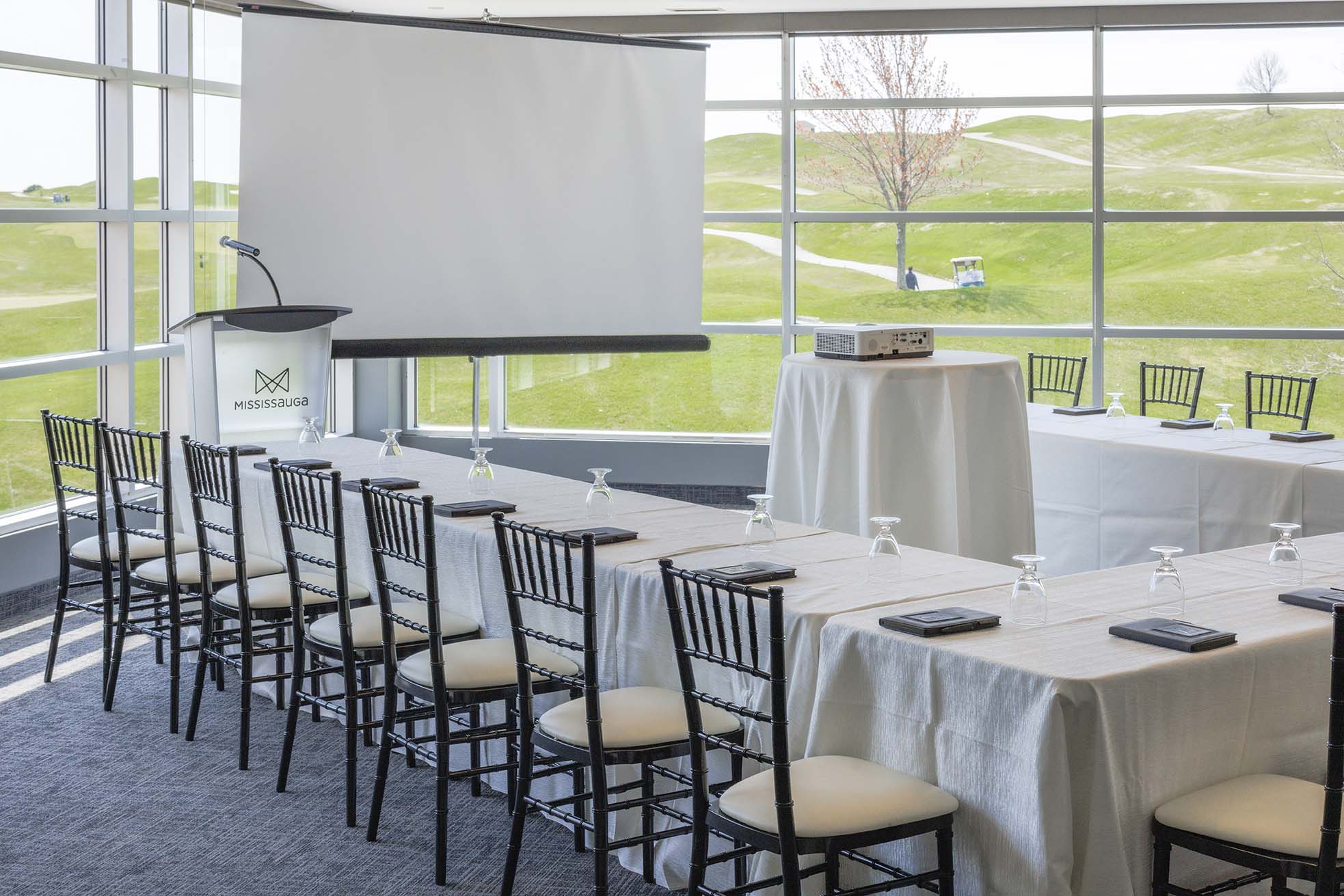 Chiavari chairs setup at a table with pink and white linens